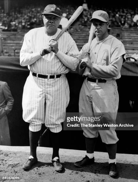 Babe Ruth, right fielder of the New York Yankees and Jimmie Foxx, first baseman for the Philadelphia Athletics, pose for a portrait prior to a game,...