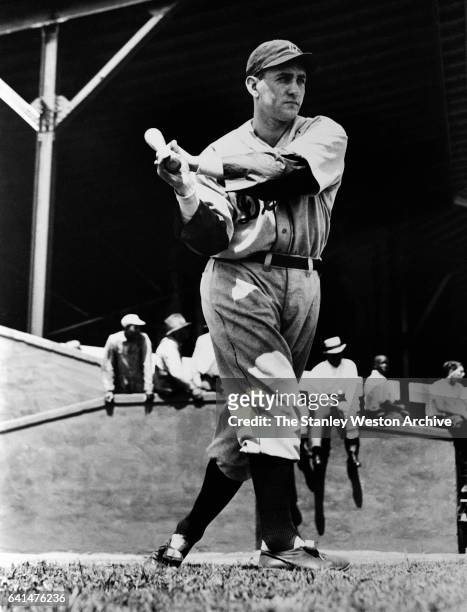 Charles Leonard Gehringer, 2nd baseman of the Detroit Tigers swings his bat during training, circa 1935.