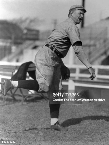 Christy Mathewson, manager and player of the Cincinnati Reds, following through a pitch, training at Shreveport, LA, 1916.