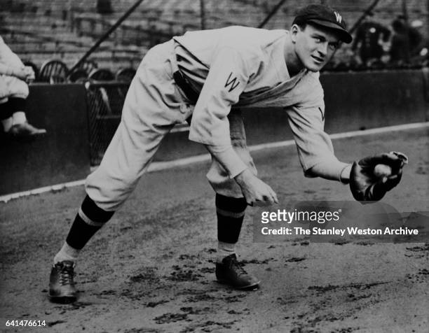Joe Cronin, shortstop of the Washington Senators, grabs a ground ball, circa 1930.