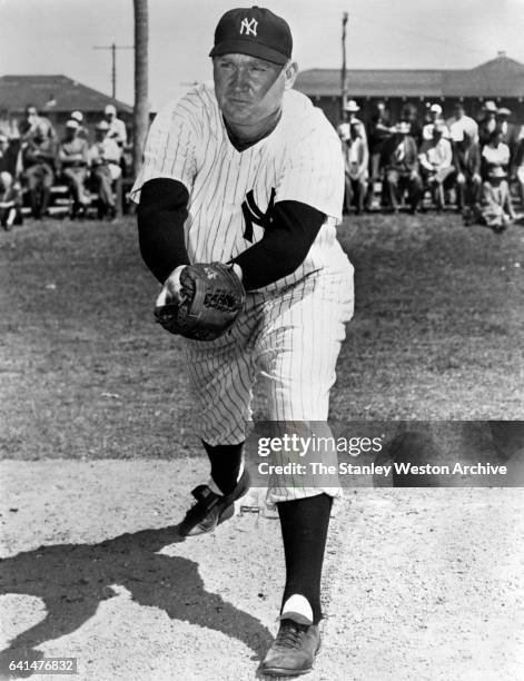 Johnny Mize, slugger for the New York Yankees, takes some fielding practice at their spring training site in St.Petersburg, Florida in March of 1947.