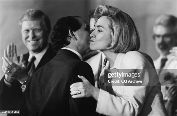 Hillary Clinton and Senator Paul Wellstone share a cheek kiss at health care rally in Russell Senate Office Building. Representative Dick Gephardt...