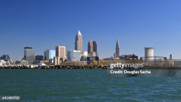 cleveland skyline on the lake erie shore - cleveland ohio flats stock pictures, royalty-free photos & images