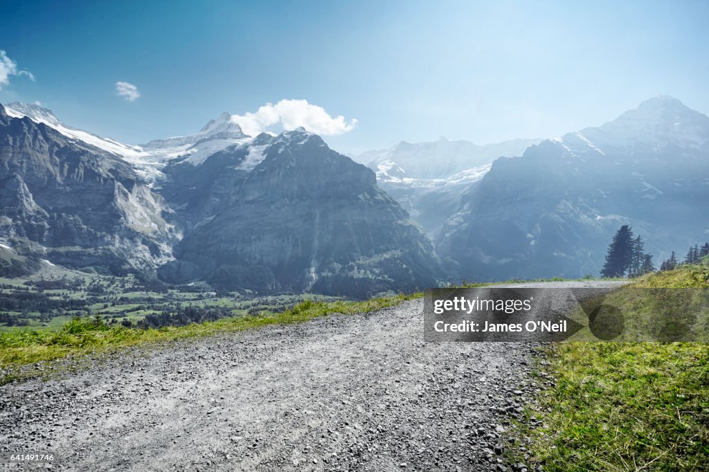 Gravel road through mountain range