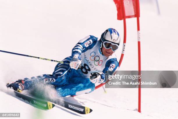 Alberto Tomba of Italy competes in the Alpine Skiing Men's Giant Slalom during day twelve of the Nagano Winter Olympic Games at Mt. Higashidate of...