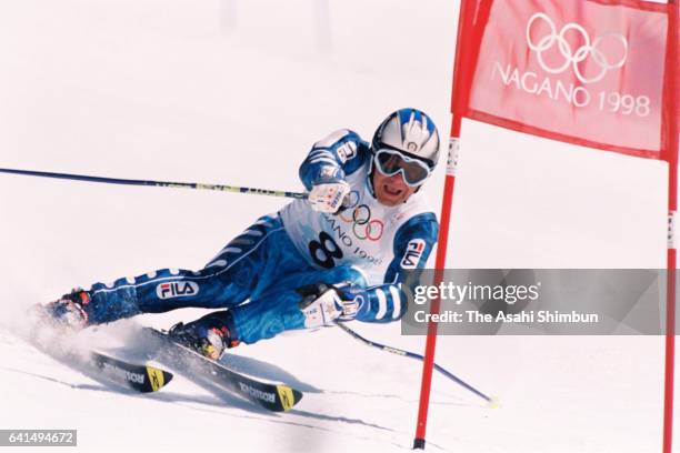 Alberto Tomba of Italy competes in the Alpine Skiing Men's Giant Slalom during day twelve of the Nagano Winter Olympic Games at Mt. Higashidate of...