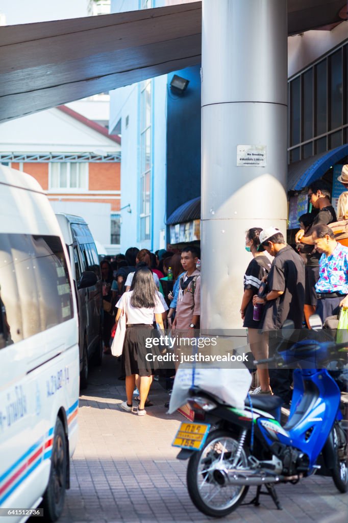 Travelling thai people at mini van station