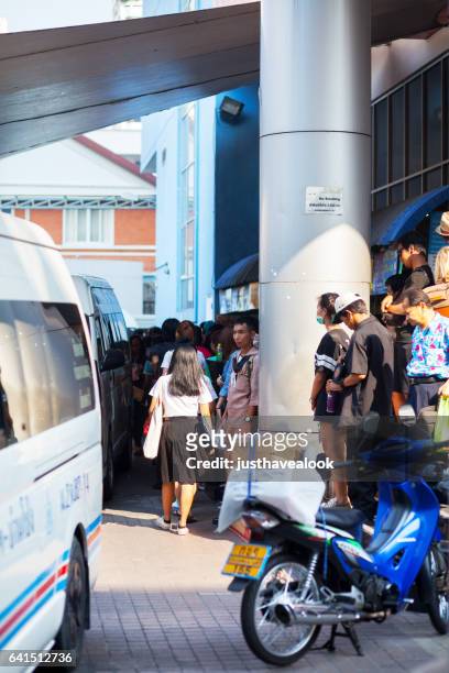 travelling thai people at mini van station - menschengruppe stock pictures, royalty-free photos & images