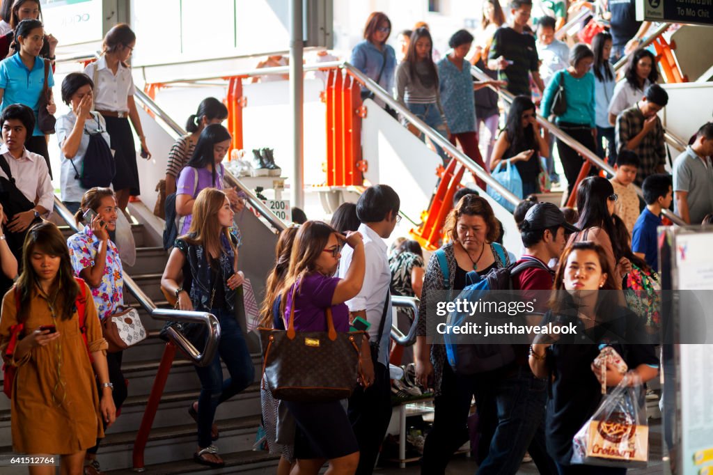 Commuters going down steps in BTS station