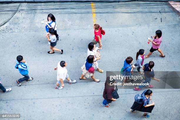 walking thai people - menschengruppe stock pictures, royalty-free photos & images