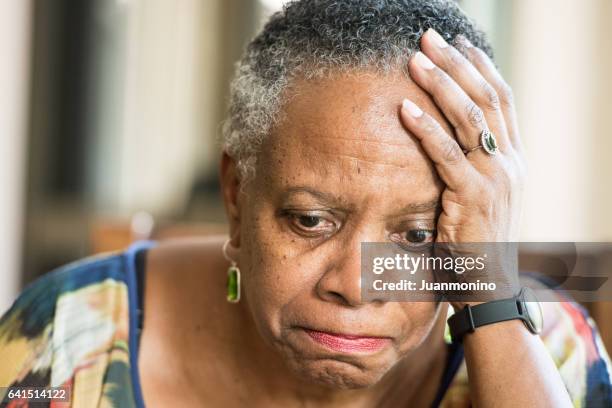 sad senior woman - afro caribbean and american stock pictures, royalty-free photos & images