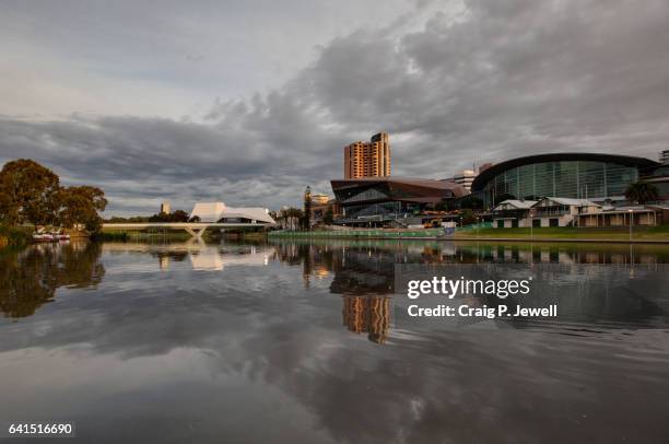 adelaide convention centre and festival centre across the river torrens under a gloomy evening sky - adelaide festival centre bildbanksfoton och bilder