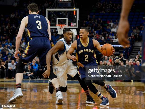 Omer Asik of the New Orleans Pelicans sets a pick for Kris Dunn of the Minnesota Timberwolves as teammate Tim Frazier drives to the basket during the...