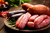 Sausages variation on dark wood table