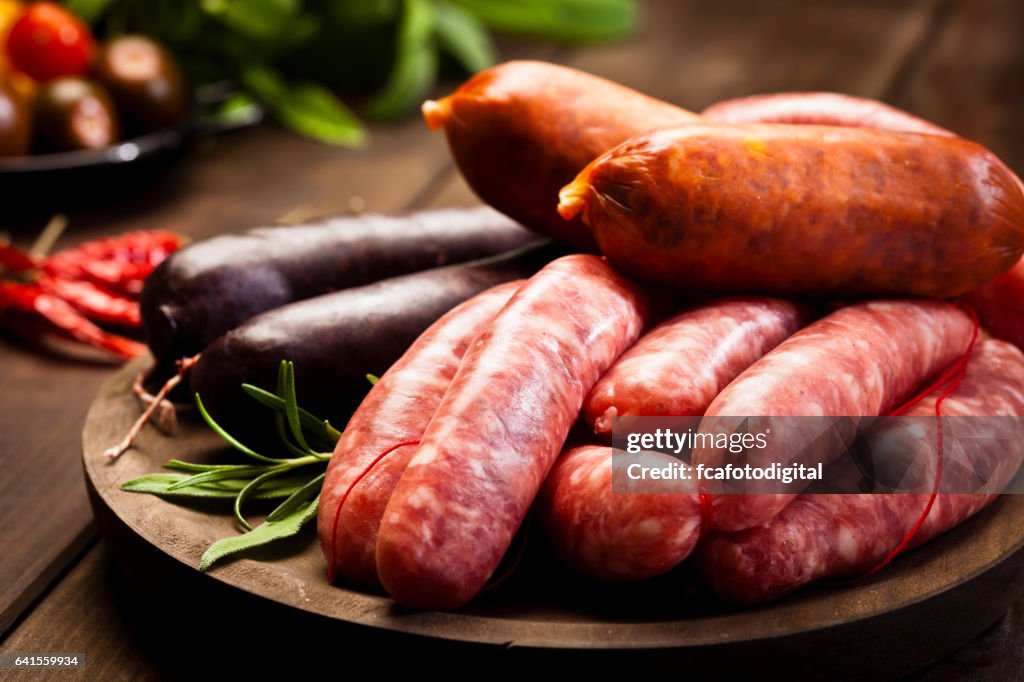 Sausages variation on dark wood table