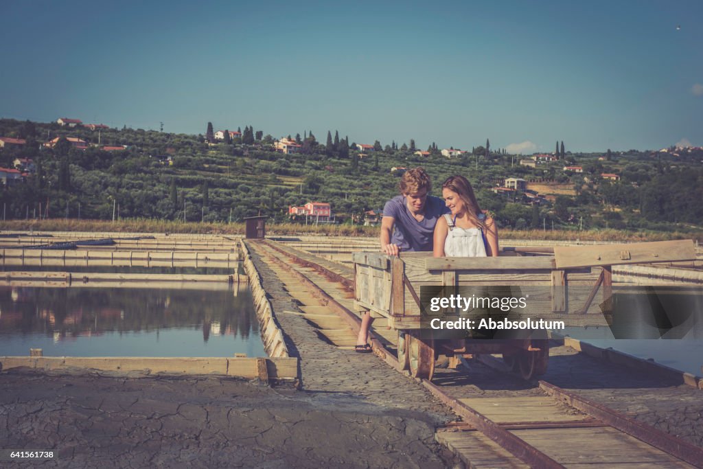 Playful Caucasian Couple Enjoying the Salt Pans,  Portorose, Slovenia, Europe