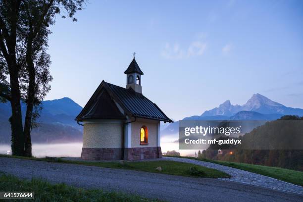 chapel in berchtesgaden with watzmann and nebel on the königssee - upper bavaria stock pictures, royalty-free photos & images