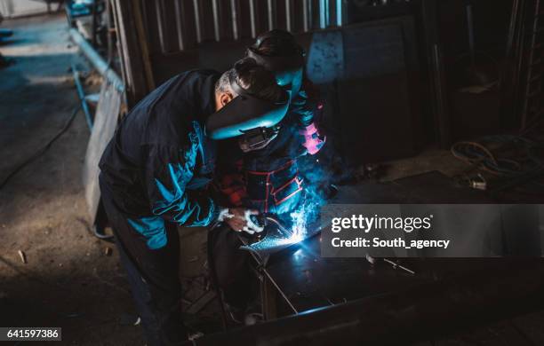 welders working together - steel worker stock pictures, royalty-free photos & images