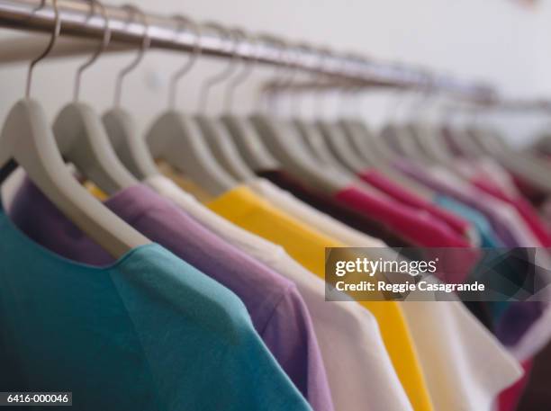 t-shirts on hangers - clothes fotografías e imágenes de stock