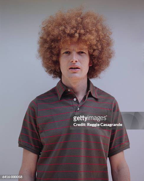man with afro - afro hairstyle stock pictures, royalty-free photos & images