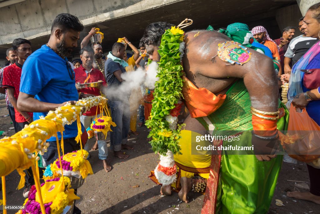 Hindu devotees performing a pray session during Thaipusam festival