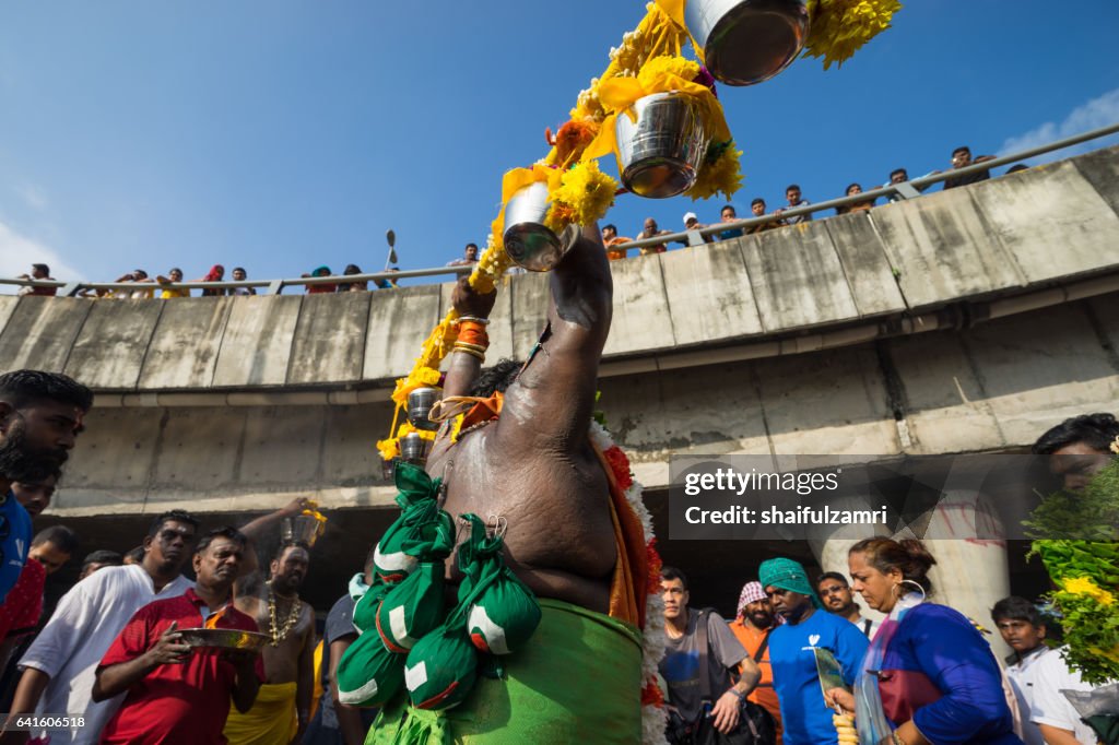 Hindu devotees performing a pray session during Thaipusam festival