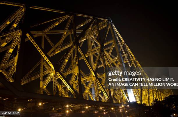 golden howrah bridge - howrah bridge stock pictures, royalty-free photos & images