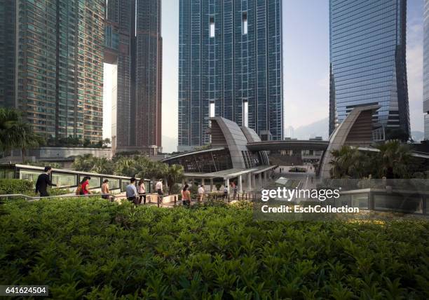 morning commute at kowloon station, hong kong - commercial buildings hong kong morning stock pictures, royalty-free photos & images