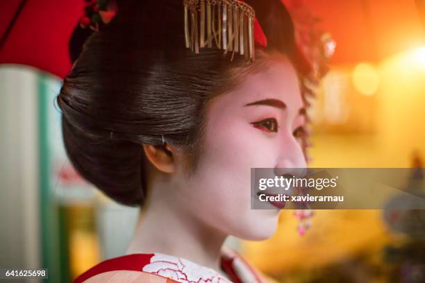 close-up side view of thoughtful young geisha - geisha in training stock pictures, royalty-free photos & images