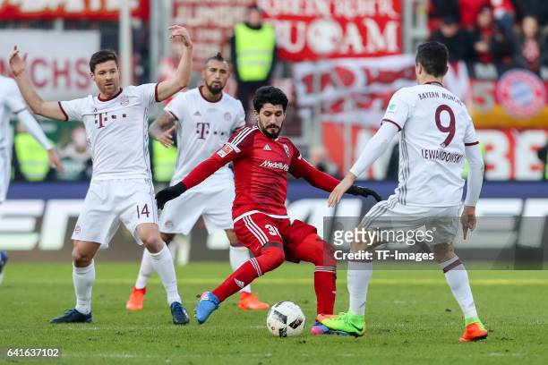 Almog Cohen of FC Ingolstadt and Robert Lewandowski of Bayern Muenchen controls the ball during the Bundesliga match between FC Ingolstadt 04 and...