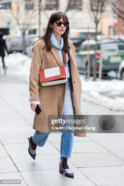 Guest wearing a beige coat outside Creatures of the Wind on February 11, 2017 in New York City.