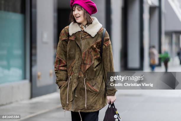 Model wearing a purple beret, jacket outside Creatures of the Wind on February 11, 2017 in New York City.