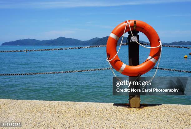 lifeguard ring buoys - buoy stock pictures, royalty-free photos & images