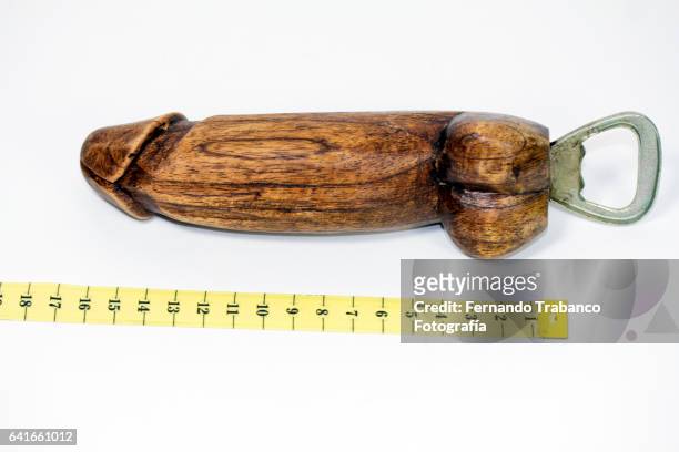 penis of wood measured with a meter - penis humour photos et images de collection
