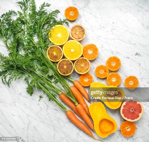 orange food on marble - winter vegetables foto e immagini stock