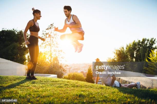 friends exercising outdoors - hot spanish women stock pictures, royalty-free photos & images