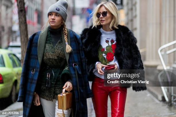 Nina Suess wearing a navy checked coat, grey beanie, white pants, heels and Lisa Hahnbueck wearing 0611 Fur Jacket, Off White Rose Embroidered and...