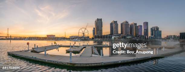 waterfront city docklands in melbourne, australia with panorama view during the sunset. - melbourne docklands stock pictures, royalty-free photos & images