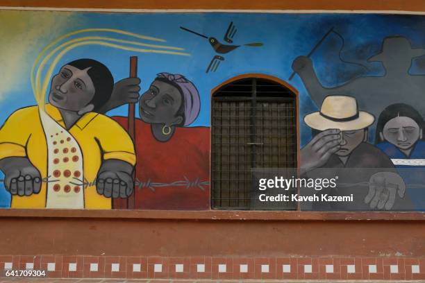 Mural of Páez people, also known as the Nasa painted on the church wall seen on December 29, 2016 in Toribio, Colombia. Toribio was one of the worst...