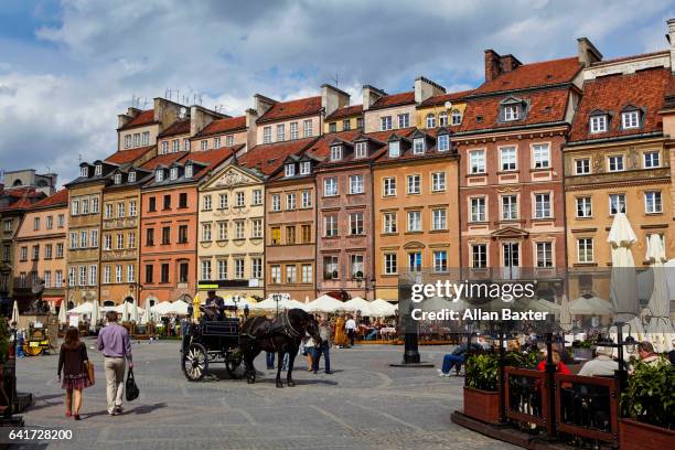 cafes and bars in the old town market square - warschau stockfoto's en -beelden