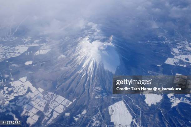 snow capped mt. iwate aerial view from airplane - 岩手山 ストックフォトと画像