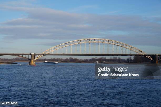 historic waalbrug bridge in the sunshine, nijmegen, the netherlands - 1936 stock pictures, royalty-free photos & images