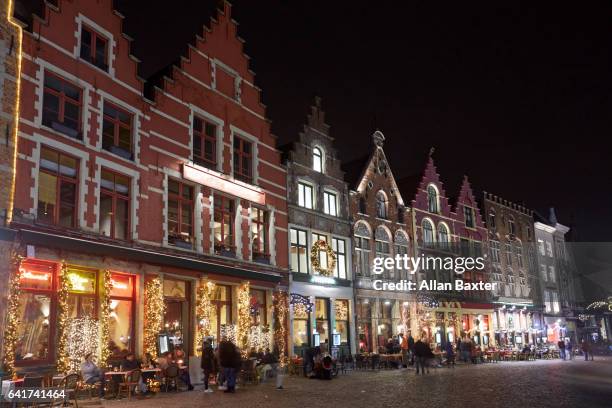 historic architecture in bruges at christmas at night - bruges stockfoto's en -beelden