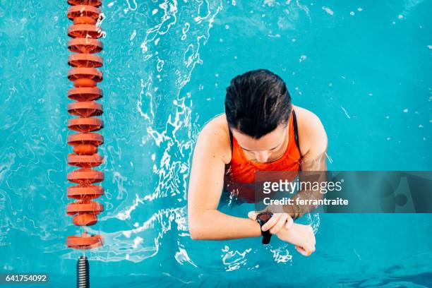 swimming lap counter watch - duration of training stock pictures, royalty-free photos & images