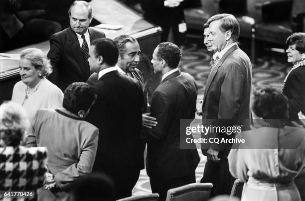 Rep. Charles Bernard "Charlie" Rangel, D- N.Y., greets Rep. Alphonso Michael "Mike" Espy, D- Miss., on the floor of the House of Representatives....