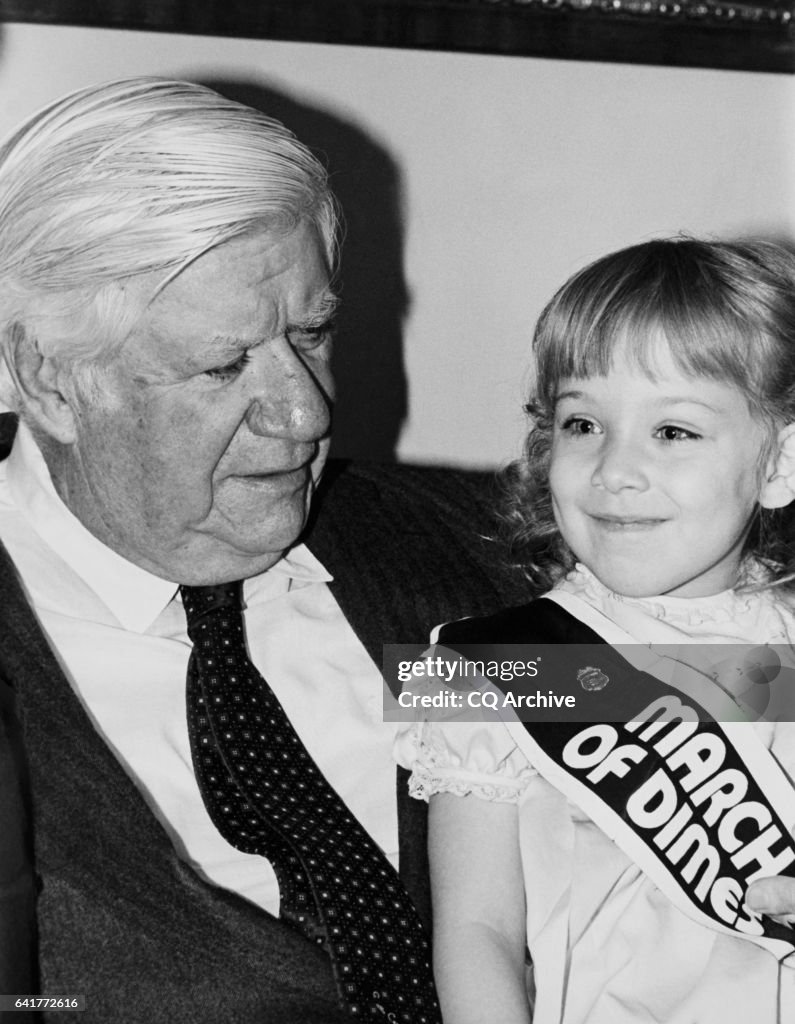 Speaker Tip O'Neill sitting with Postern child