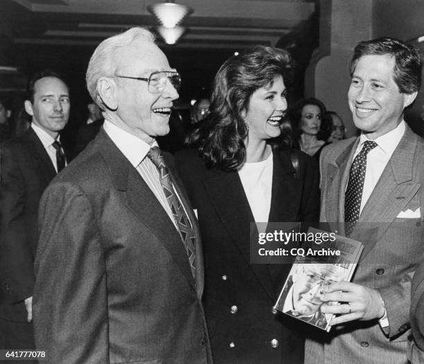 Former Speaker Rep. Jim Wright, D-Texas, Linda Carter and Robert Altman with Wright's new book. The book signing took place at The River Club in...
