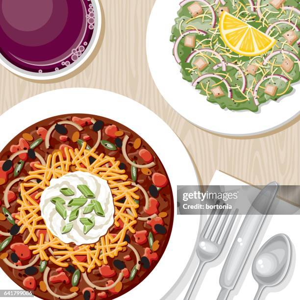 overhead view of a dinner table - caesar salad stock illustrations