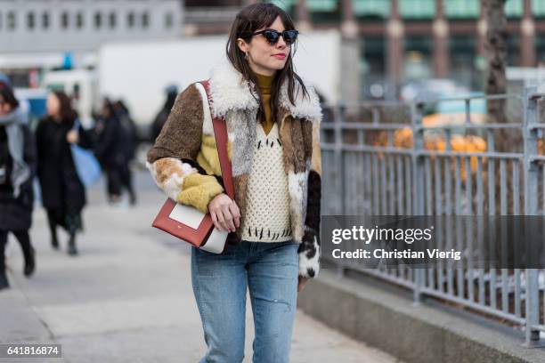 Guest wearing a Celine bag, checked fur jacket outside 3.1 Phillip Lim on February 13, 2017 in New York City.