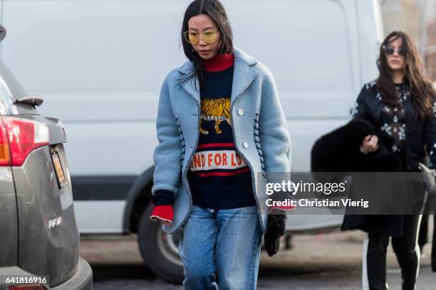 Guest wearing a knit,blue jacket outside 3.1 Phillip Lim on February 13, 2017 in New York City.